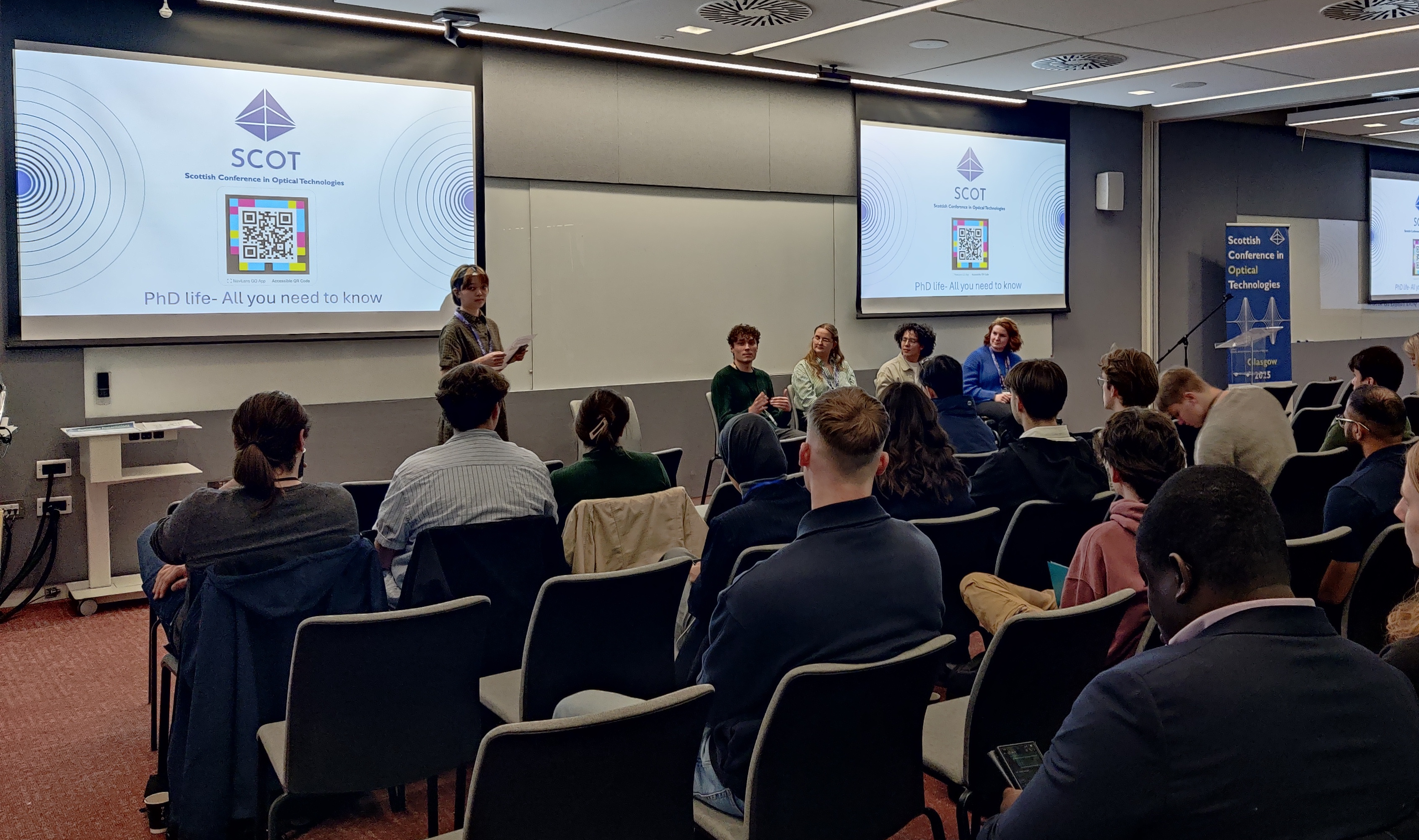 PhD Student Panel: From right to left chairing the session Mariana Annameng Ma, Charli Hamilton, Rebecca Meehan, Richard Aguiar, and Katherine Stevens